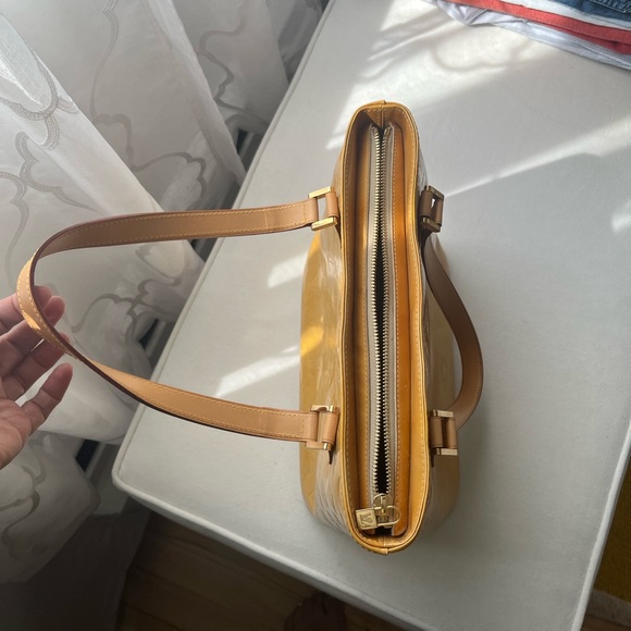 100% Authentic
Louis Vuitton Gold and Tan Houston Vernis - Picture 3 of 14